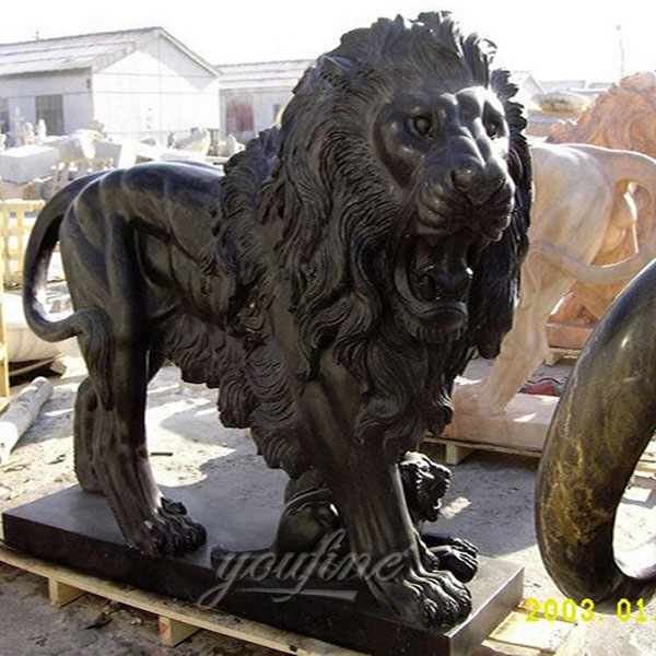Garden ornaments sleeping stone black lion statues in front of house
